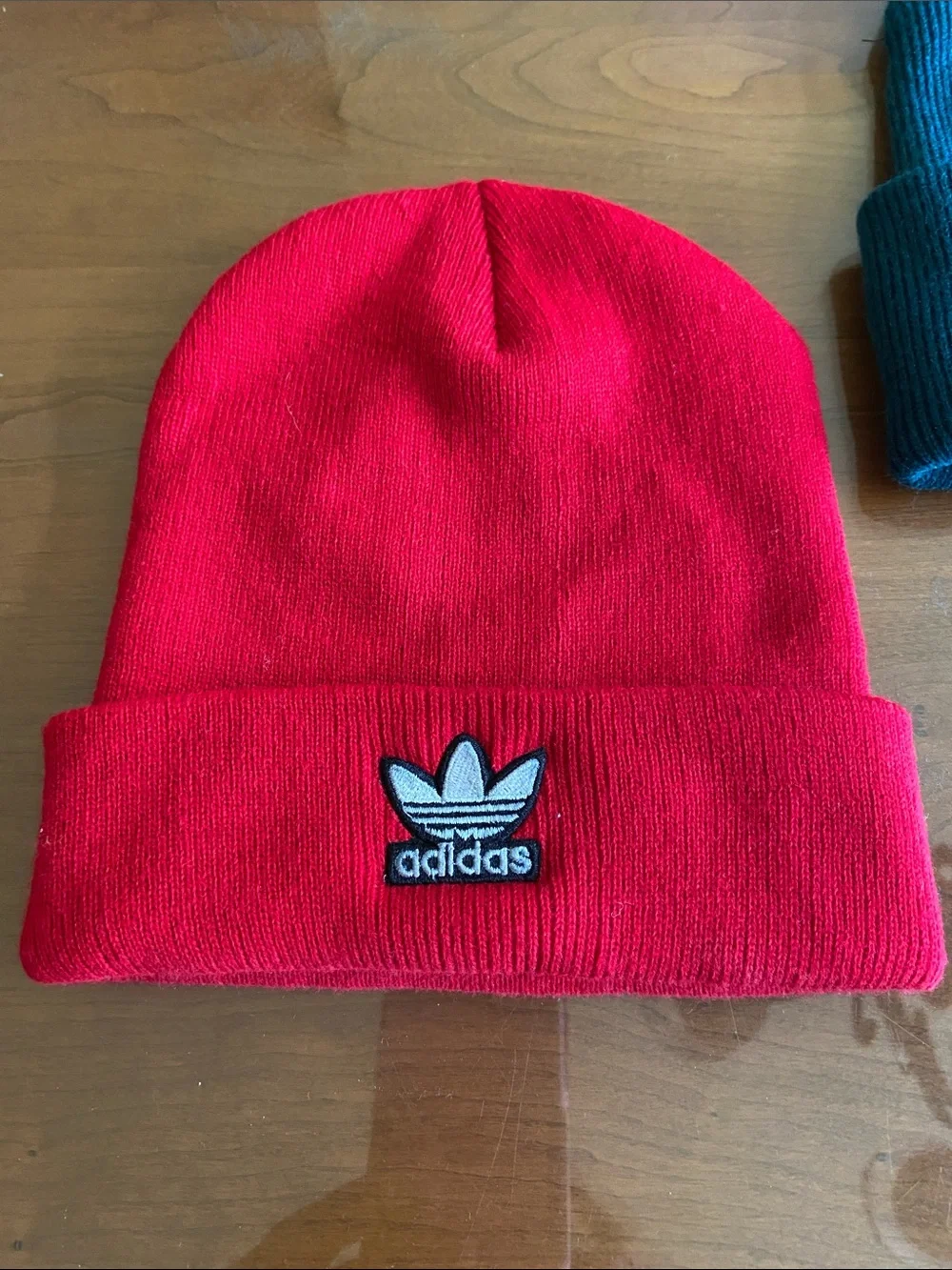 adidas Kids Red Ribbed Beanie with Trefoil Patch and Pacsun Dickies Green Hat.
